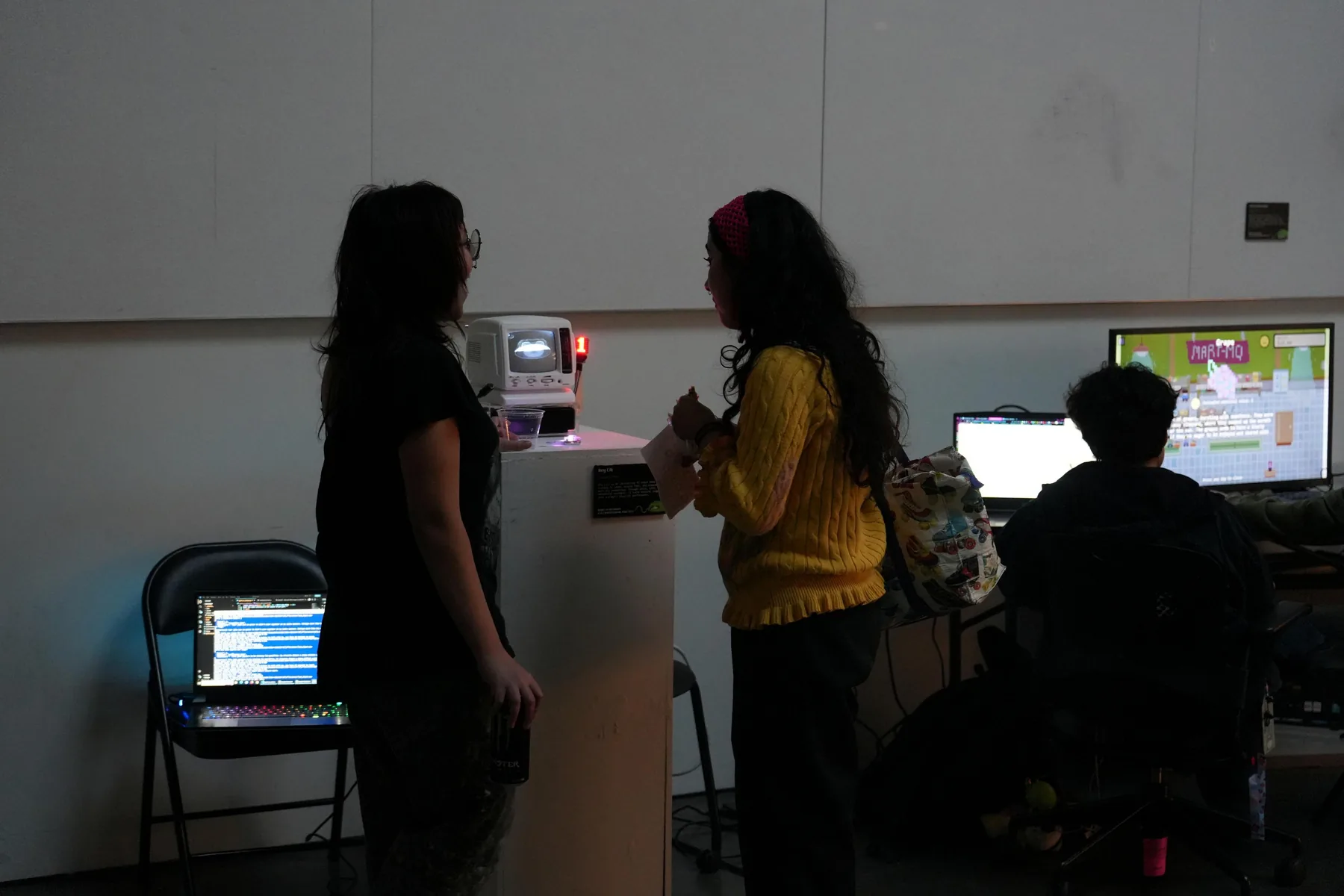 Visitors gathered around interactive works in the exhibition