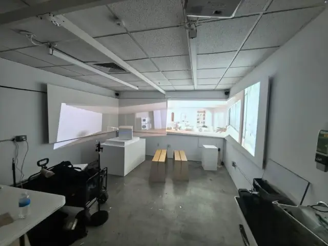 A scale room prototype testing three-wall projection